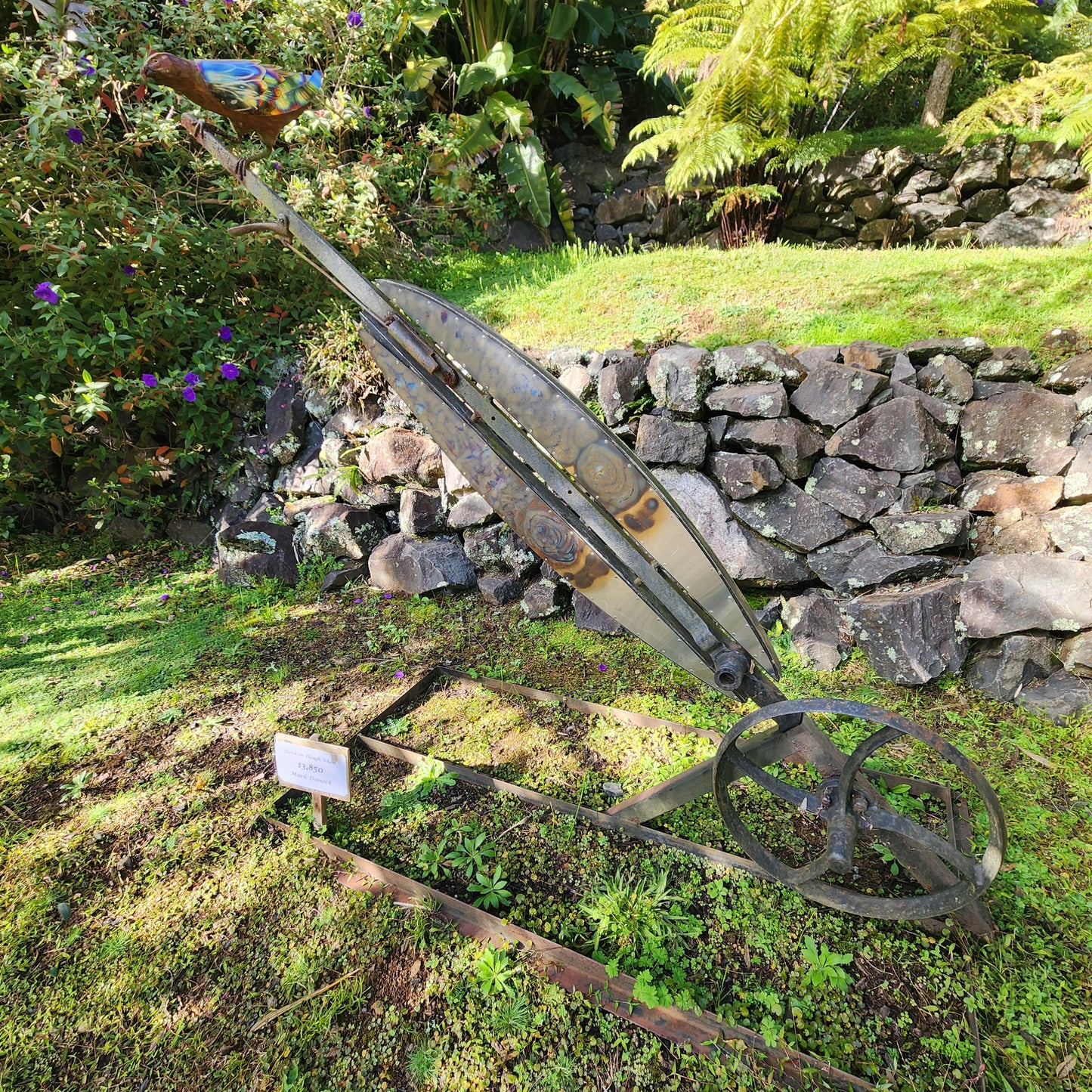 Hawk on Plough Wheel