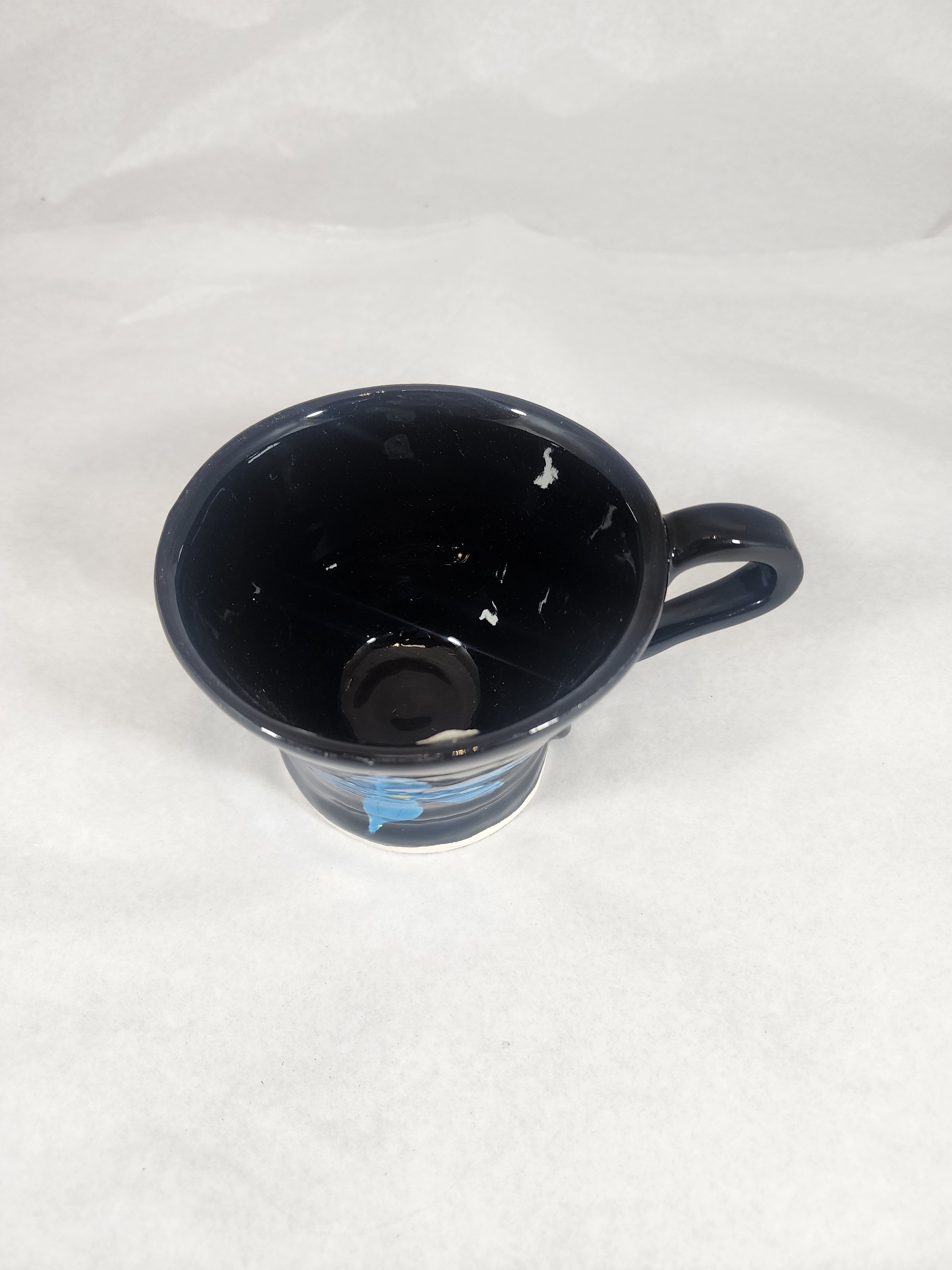 Black Cup with Hibiscus Flower