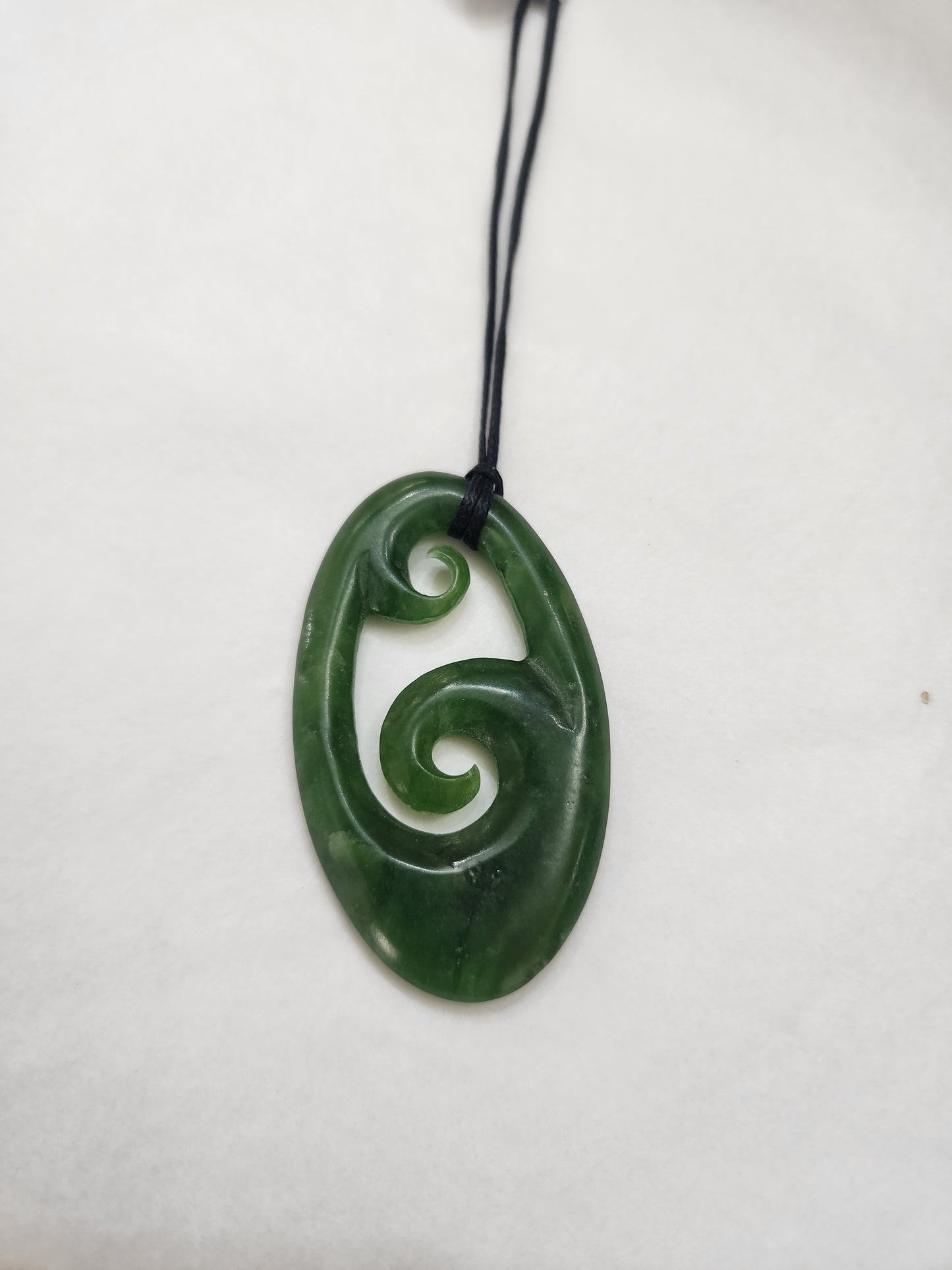 Korus in Large Oval Pendant - Pounamu