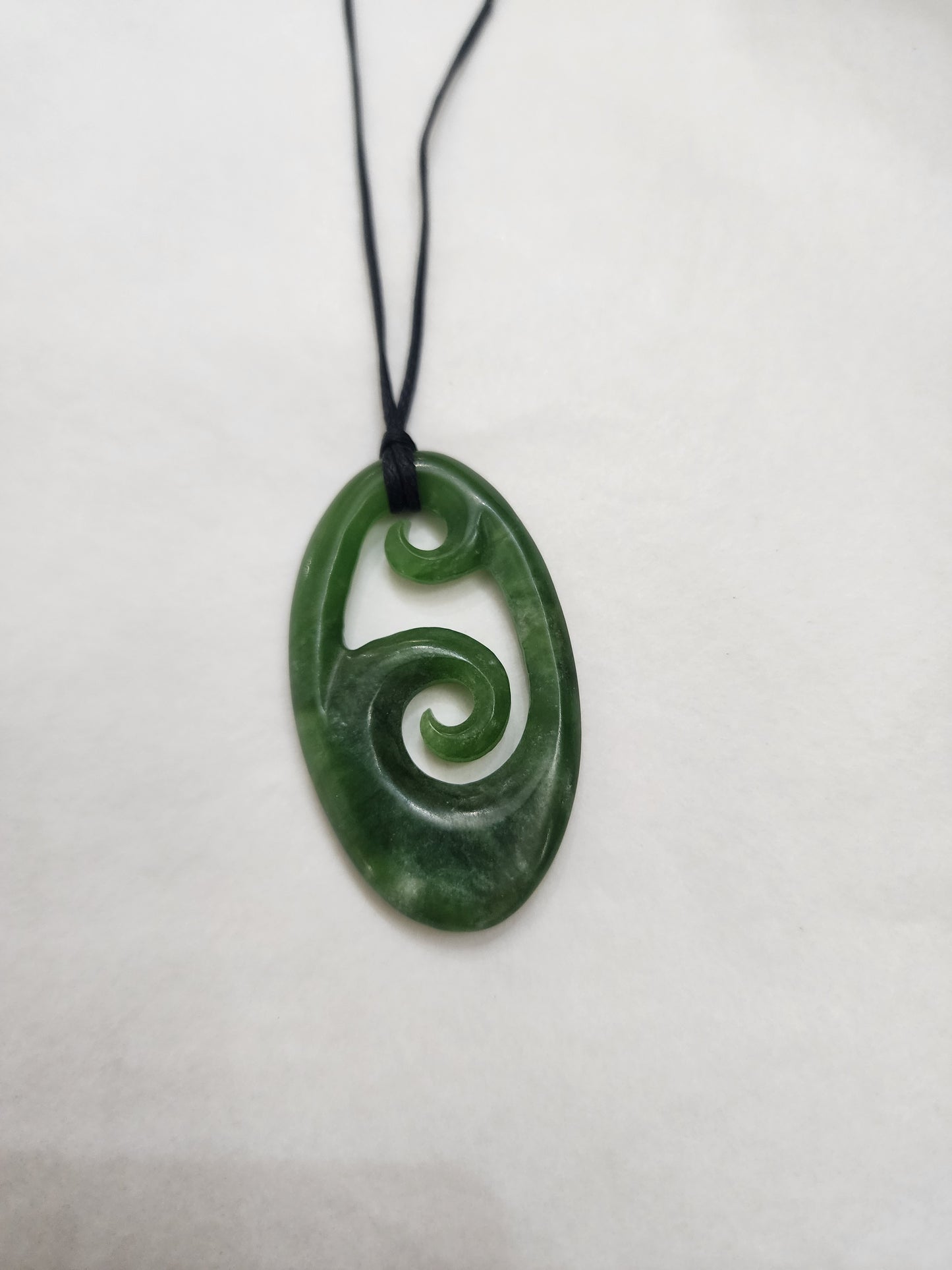 Korus in Small Oval Pendant - Pounamu
