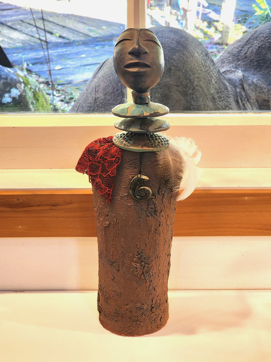 Sculpture with Koru Necklace and Feather